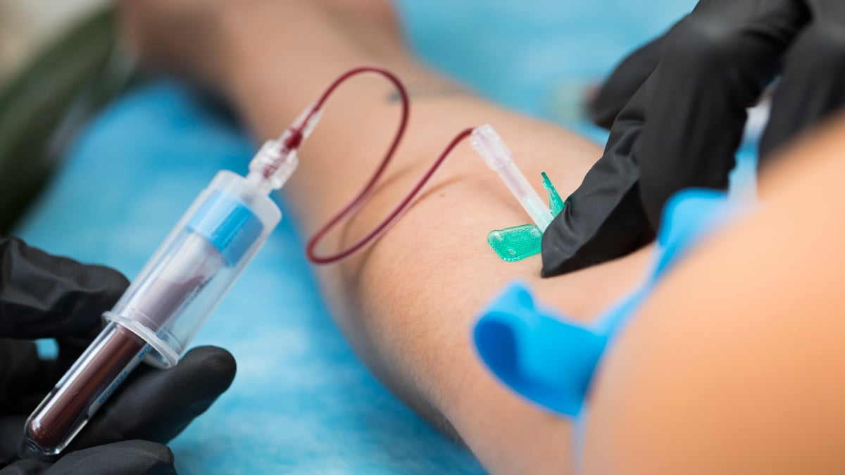Nurse taking blood samples in a modern hospital setting